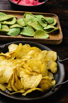 Limon Flavored Potato Chips, on old dark wooden table background