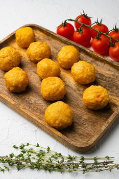 Battered sausage meat ball, on white stone table background
