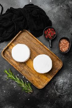 Brie cheese, on black dark stone table background, top view flat lay