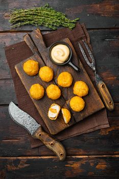 Battered meatballs, on old dark wooden table background, top view flat lay