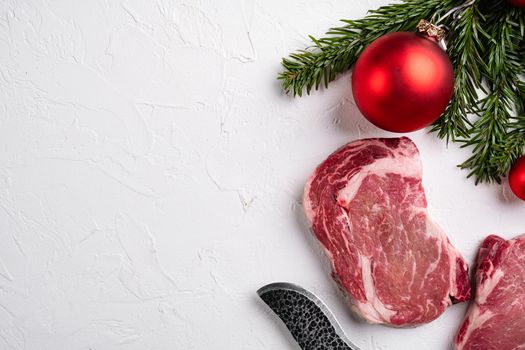 Rib eye steak new year set, on white stone table background, top view flat lay, with copy space for text