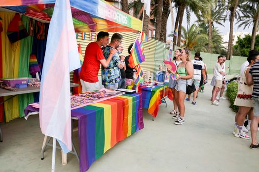Santa Pola, Alicante, Spain- July 2, 2022: Merchandise Stands selling flags and other items at the Gay Pride Festival in Santa Pola