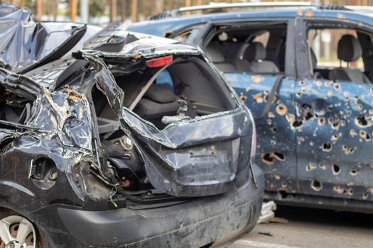 Car riddled with bullets. War of Russia against Ukraine. A car of civilians shot by the Russian military during the evacuation of women and children. Traces of bullets and fragments of shells