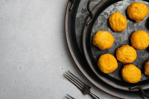 Battered meatballs, on gray stone table background, top view flat lay, with copy space for text