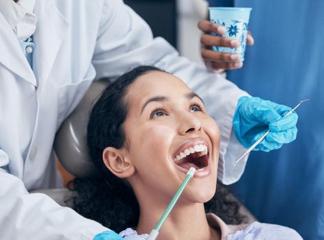 Shot of a young woman having a procedure performed by her dentist.