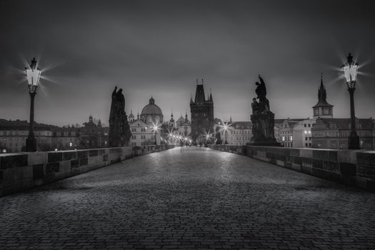 Charles bridge on Vltava river at night - Prague, Czech Republic