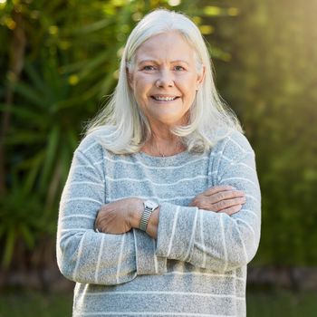 Shot of a senior woman standing outdoors.