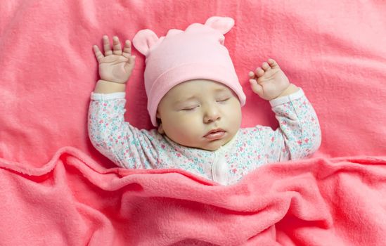 Baby sleeps with a bear. Selective focus. people.