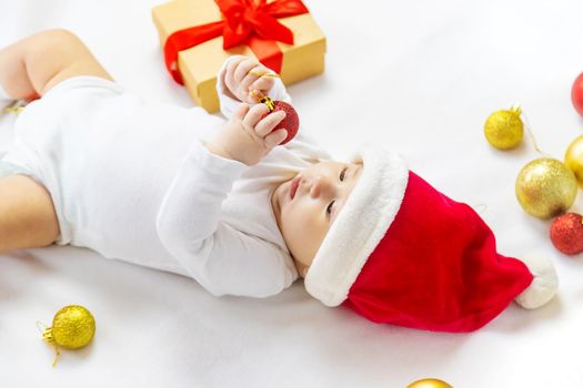 Christmas photo of baby with New Year's decor. selective focus. holiday.