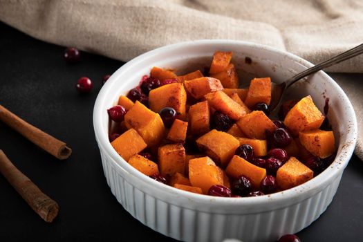 Baked butternut squash and cranberries with honey and cinnamon, just out of the oven.