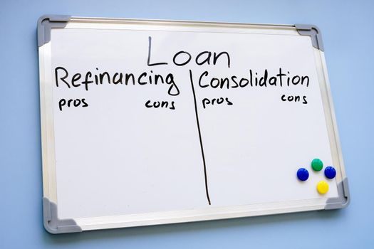 A Whiteboard with written words Loan refinancing vs consolidation.