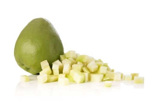 Fresh whole and cubed chayote squash isolated on a white background.