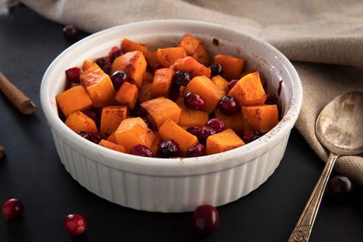 Baked butternut squash and cranberries with honey and cinnamon, just out of the oven.