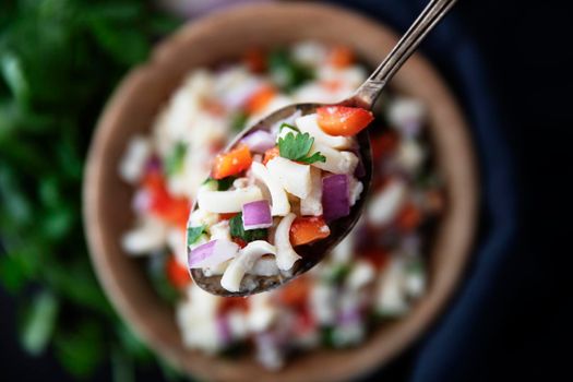 Vegan salad with hearts of palm, red onion, pepper, cilantro and lime dressing.