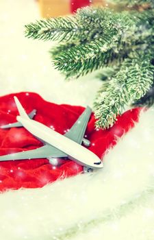 Beautiful Christmas background with airplane. Selective focus. Celebration.