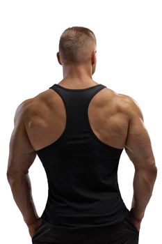 Portrait of an attractive athlete in a black tank top on a white cyclorama in the studio. Sports lifestyle.