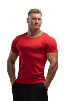 Portrait of an attractive athlete in a red t-shirt on a white cyclorama in the studio. Sports lifestyle.