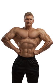 Professional bodybuilder in a dry filled form in a large weight category posing on white background. Bodybuilding culture.