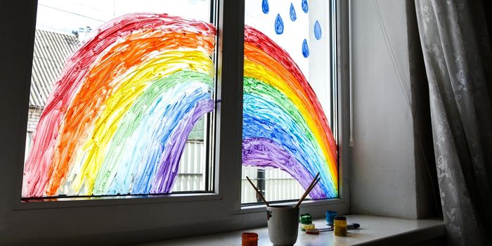 let's all be well. public flashmob children paint a rainbow on the windows waiting for the end of the quarantine pandemic coronavirus entertainment leisure home, copy space for text