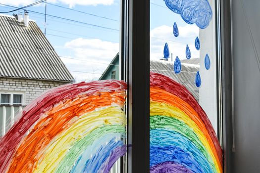 let's all be well. public flashmob children paint a rainbow on the windows waiting for the end of the quarantine pandemic coronavirus entertainment leisure home, copy space for text