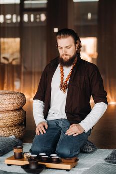 The tea master is preparing to hold a tea ceremony in the interior.