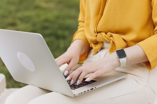 Closeup coding on computer, woman hands coding html and programming on screen laptop, development web, developer. Unrecognizable professional programmer working with hands write code.