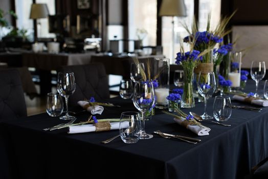 A set of furniture in a cafe. Vase with flowers decor for the restaurant.