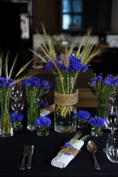 A set of furniture in a cafe. Vase with flowers decor for the restaurant.