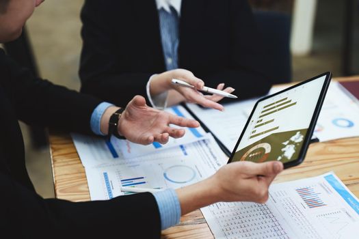 business people working together on a new project to analyze budgets and manage investment risks in today 's profit boosting for marketing in the office room.