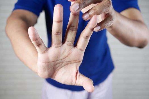 man suffering pain in hand close up .