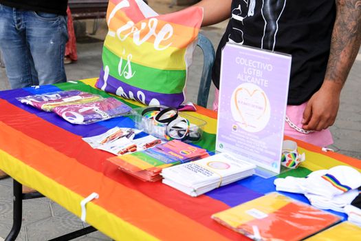 Santa Pola, Alicante, Spain- July 2, 2022: Merchandise Stands selling flags and other items at the Gay Pride Festival in Santa Pola