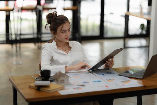 Image of Young woman working online on laptop computer. studying or working from home online concept