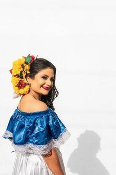 Vertical Portrait of latin young girl on white background smiling to camera