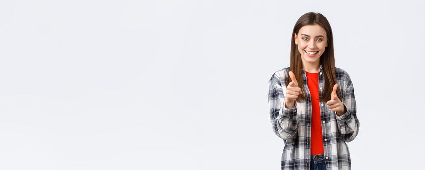 Lifestyle, different emotions, leisure activities concept. Enthusiastic and happy young pretty girl in casual outfit pointing fingers at camera, gotcha or congratulations gesture, choosing you.