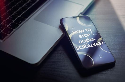How to stop Doomscrolling - on the smartphone screen display concept.
