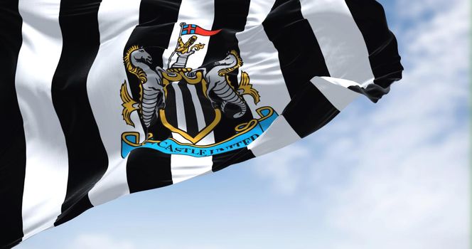 Newcastle, UK, May 2022: The flag of Newcastle United waving in the wind on a clear day. Newcastle United is an English professional football club
