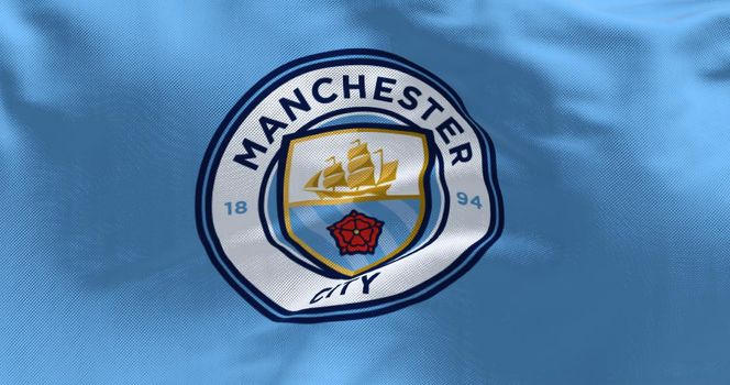 Manchester, UK, May 2022: Fabric background with the Manchester City Flag waving. Manchester F.C. is a professional football club based in Bradford, Manchester