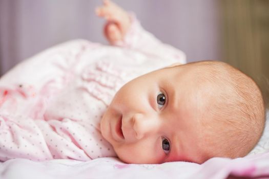 Beautiful smiling cute baby. Beautiful expressive adorable happy cute laughing smiling baby infant face. Children, people, infancy and age concept - beautiful happy baby