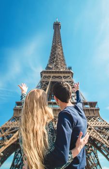 Couple woman and man near the eiffel tower. Selective focus. People.