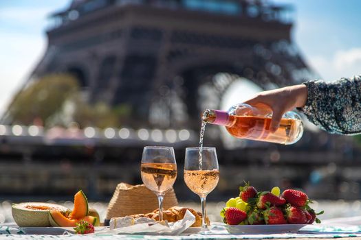 Picnic and wine near the Eiffel Tower. Selective focus. Food.