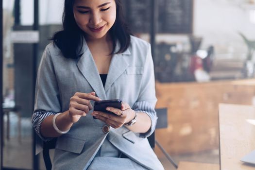 Woman using smartphone and searching about product online market. Shopping Online concept