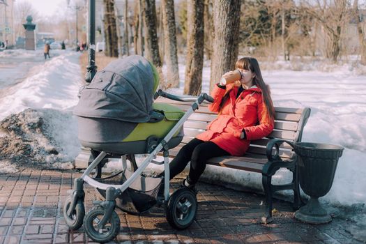 Mom on a walk with a stroller lifestyle. An article about choosing a stroller. An article about walking with children. The use of fresh air for kids. Modern moms. City walks with a stroller .