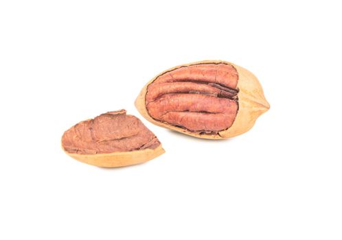 Pecan nut with broken shell isolated on white background