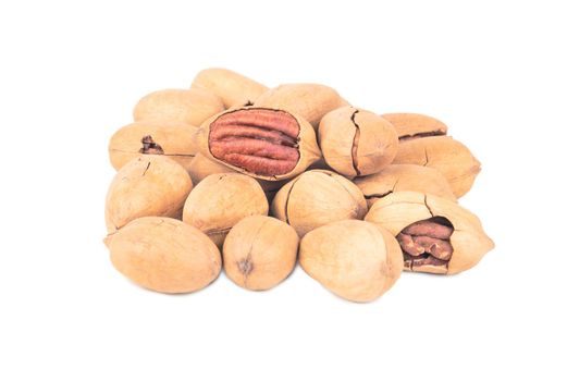 Bunch of inshell pecans on white background