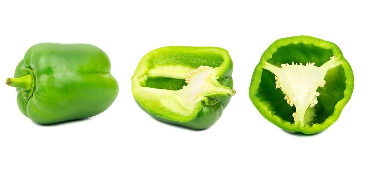 Set of fresh whole and sliced sweet green pepper isolated on white background.