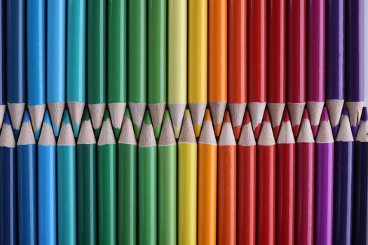Set of colored pastel pencils in row of multicolor in form of closed zipper. Selection of colors and shades in painting concept