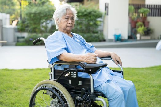 Asian senior or elderly old lady woman patient on electric wheelchair with remote control at nursing hospital ward, healthy strong medical concept