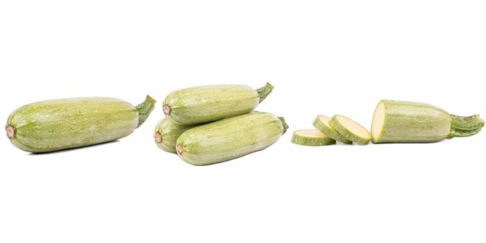 Fresh whole zucchini isolated on white background with clipping path and full depth of field. Set or collection.