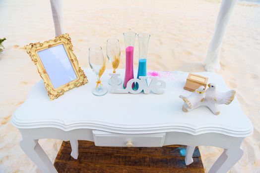 White table for a wedding ceremony on the seashore.