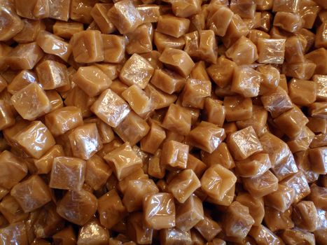 bunch of caramel candies in wrappers